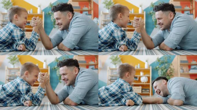 中年男子和小男孩正在练习手臂在家里享受活动