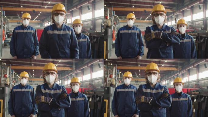 戴着呼吸面罩的工厂工人为相机摆姿势
