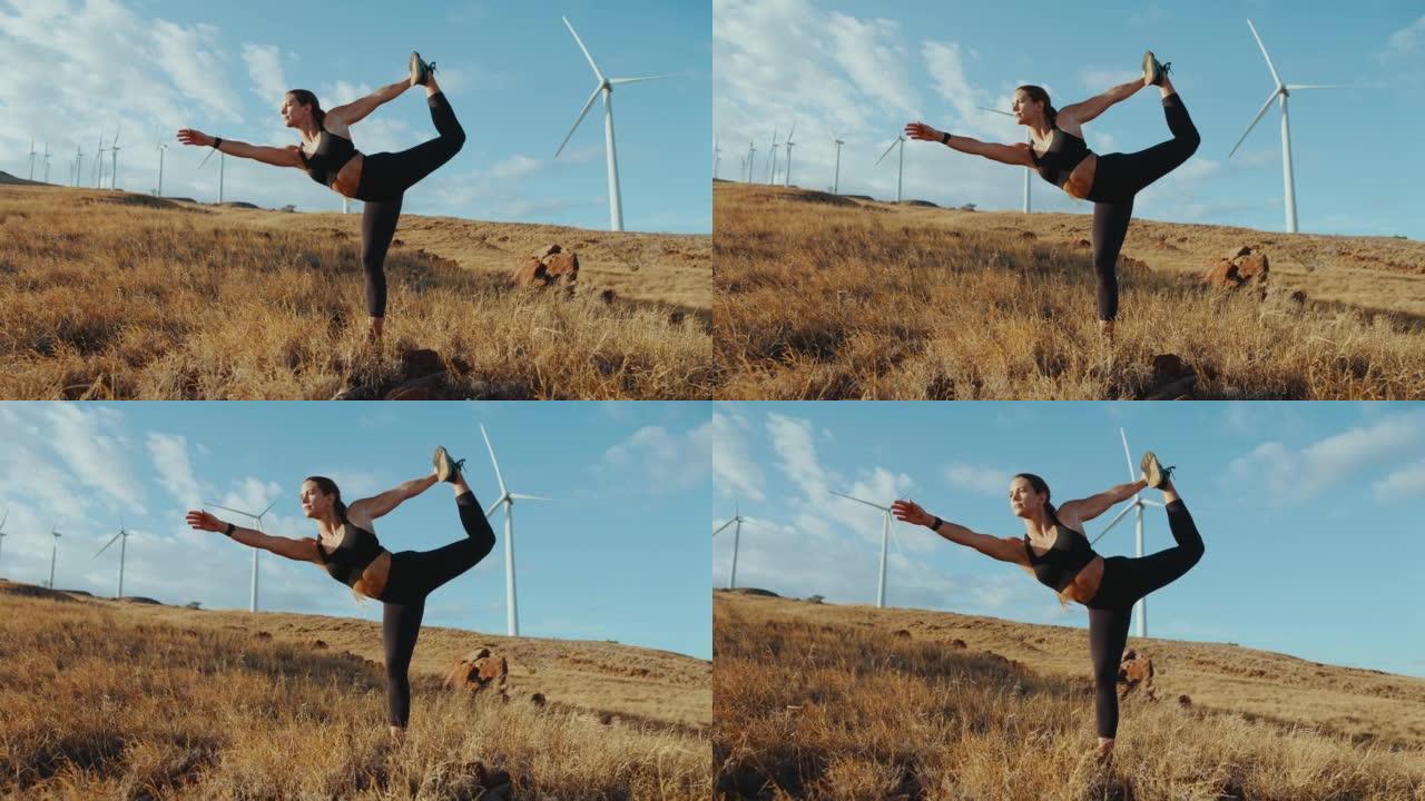 练习瑜伽的女人热身拉伸风电