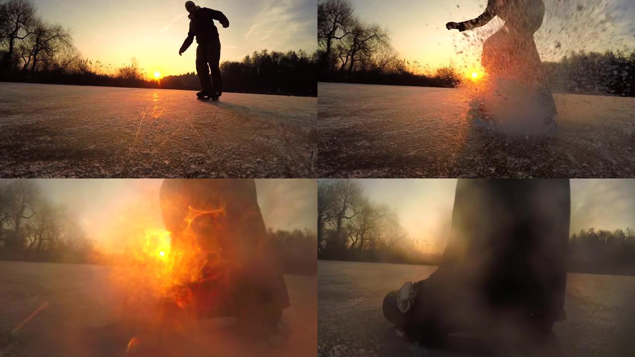 低角度: 男性滑冰运动员在日落时转向并向相机中喷射冰。