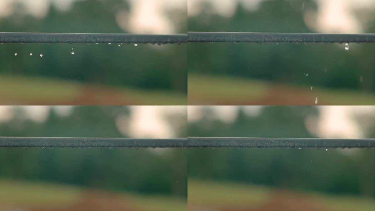 宏观: 详细的雨滴落在不锈钢阳台围栏上的镜头