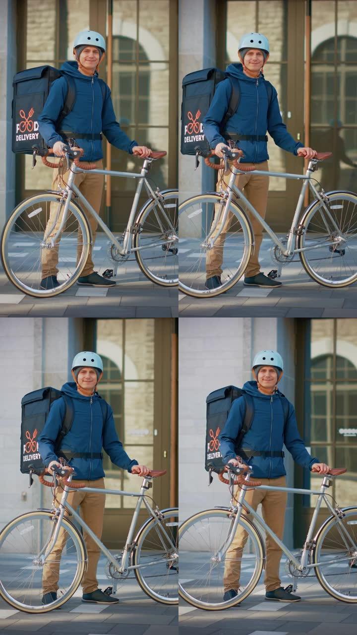 穿着保暖背包和安全帽的英俊快乐送餐男子站在时尚的现代市区的自行车旁边。垂直屏幕方向9:16的视频素材