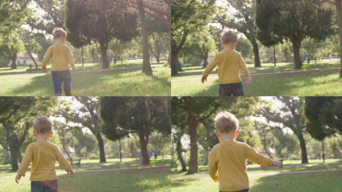 快乐的小男孩在公园或森林户外玩耍、跑步和探索。快乐的孩子在探索时玩得开心和自由。在户外的绿野或树林中
