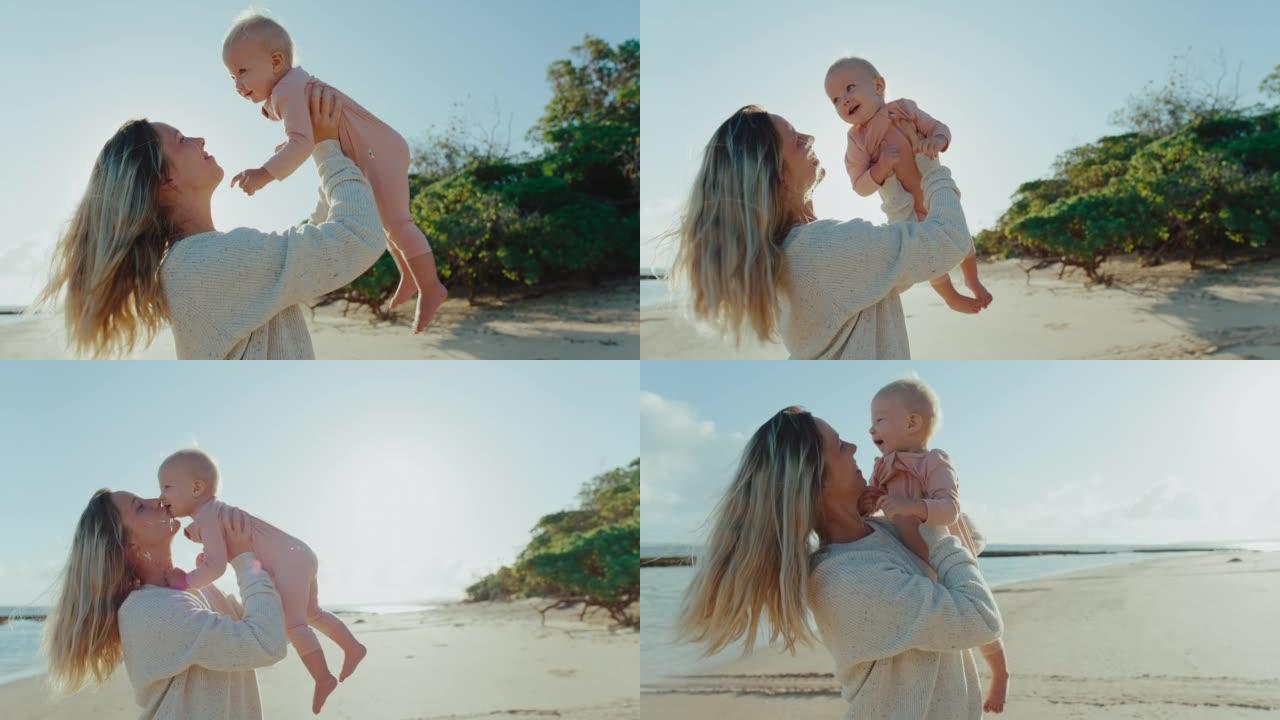 母亲和年幼的婴儿报幼儿在沙滩上玩耍