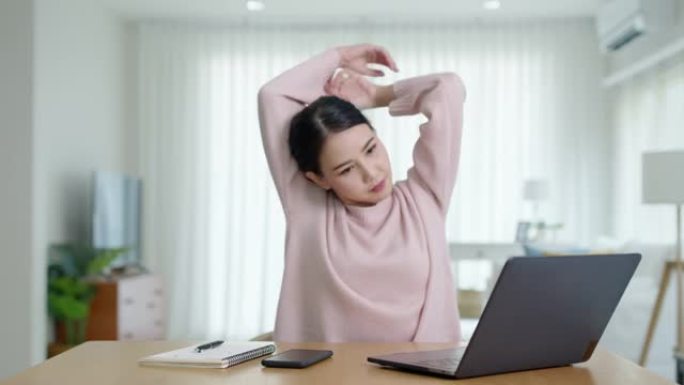 迷人美丽的年轻亚洲女性感到疲惫过度劳累负面影响健康生活伸展休息时间放松压力缓解概念问题在家远程工作或
