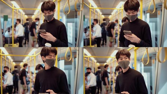 亚洲年轻男性在火车上使用智能手机并佩戴防护口罩
