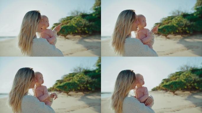 母亲和年幼的婴儿沙滩大海自然