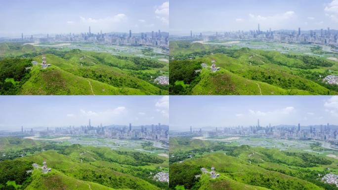 香港与中国深圳天际线之间的带有鱼塘的乡村绿地景观