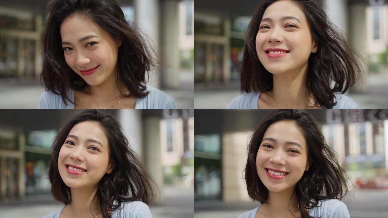 迷人的亚洲女人微笑在城市美丽的女孩肖像