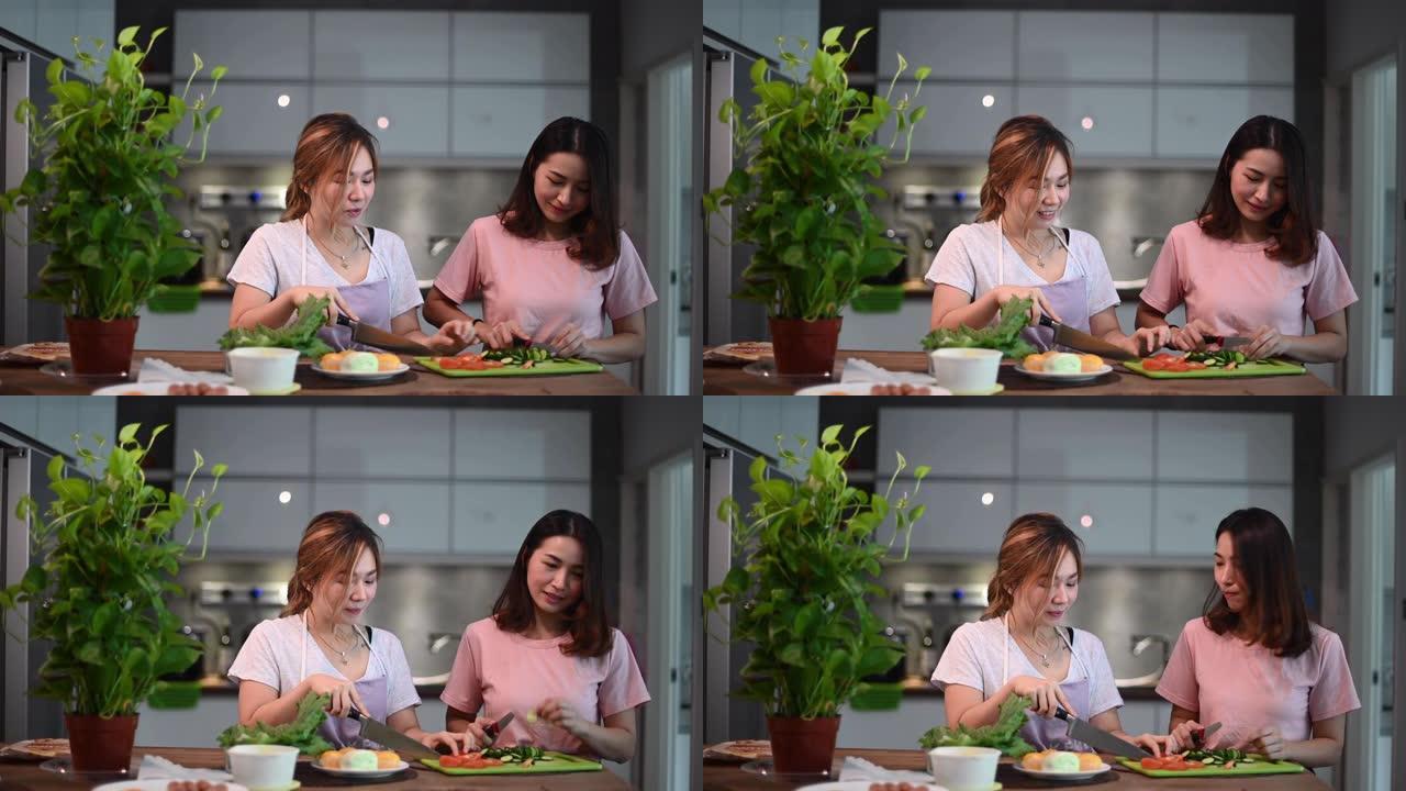 2位亚洲华人姐妹在餐厅里度过了亲密的时光，准备早餐食物快乐地交谈