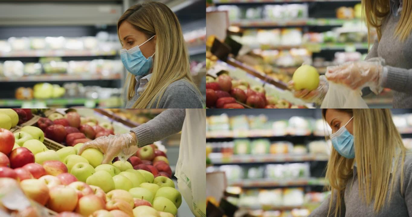 戴着医用口罩和手套保护自己免受疾病侵害的年轻女子的真实特写镜头正在超市购物时选择苹果。