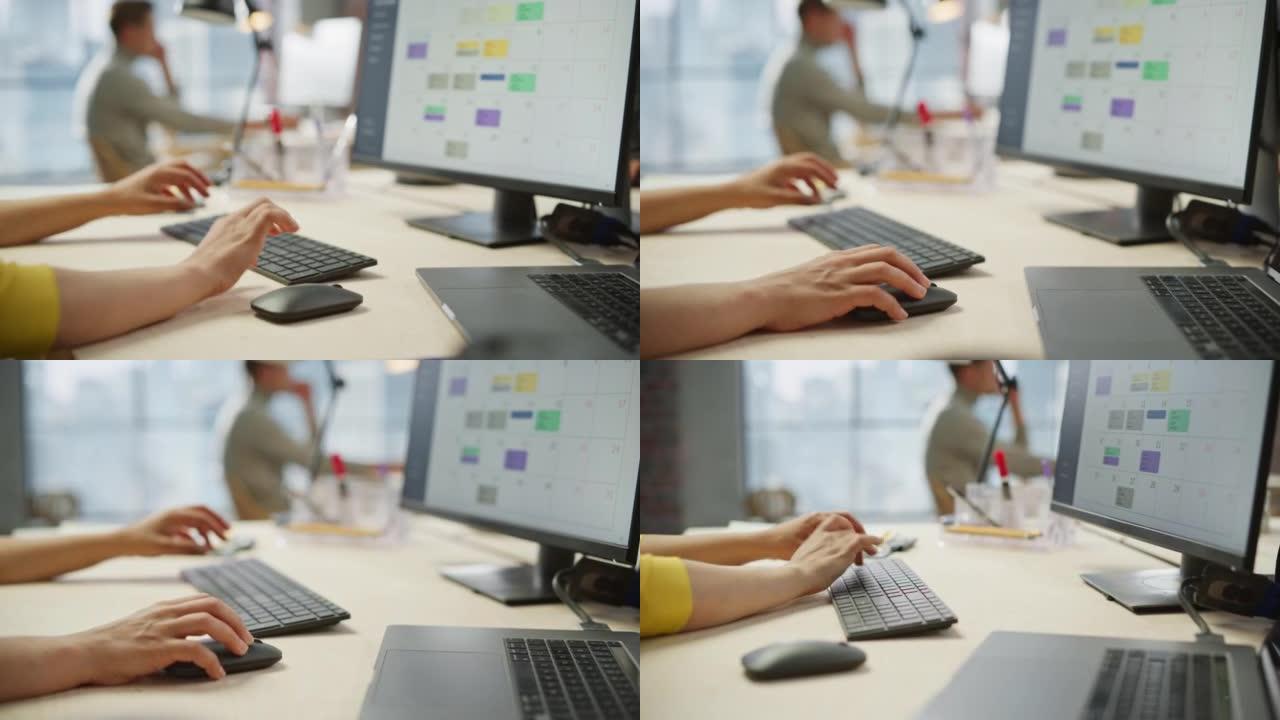 关闭女人的手在键盘和显示器上工作的镜头。年轻女子的手移动电脑鼠标和打字。女销售经理制定时间管理计划。