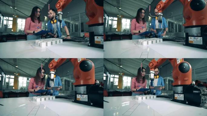 机器人爪正在研究人员的控制下重新定位物体