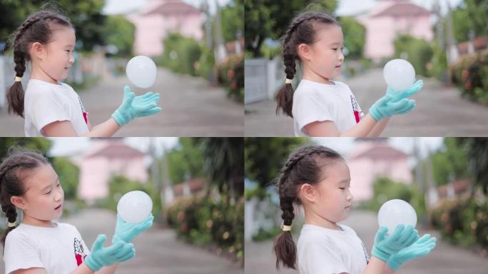 SLO MO可爱亚洲小女孩玩肥皂泡