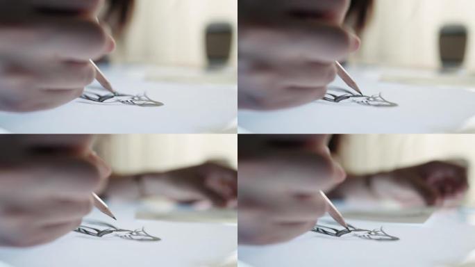 女人在纸上用铅笔素描画画