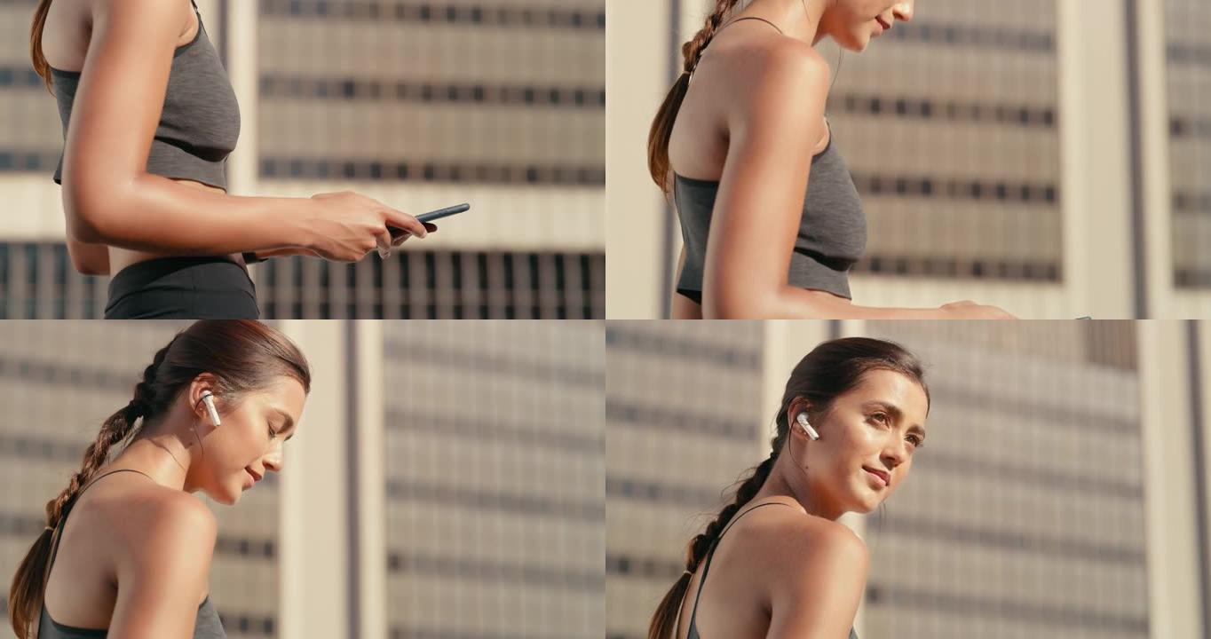 4k视频片段，一名妇女在外出跑步时戴着耳罩并拿着手机