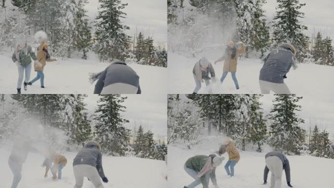 一群朋友在森林里玩雪球和欢笑冬天的日子