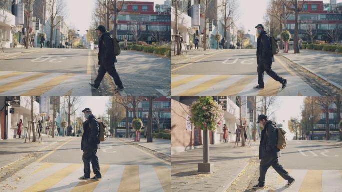 韩国首尔的男性游客过马路。