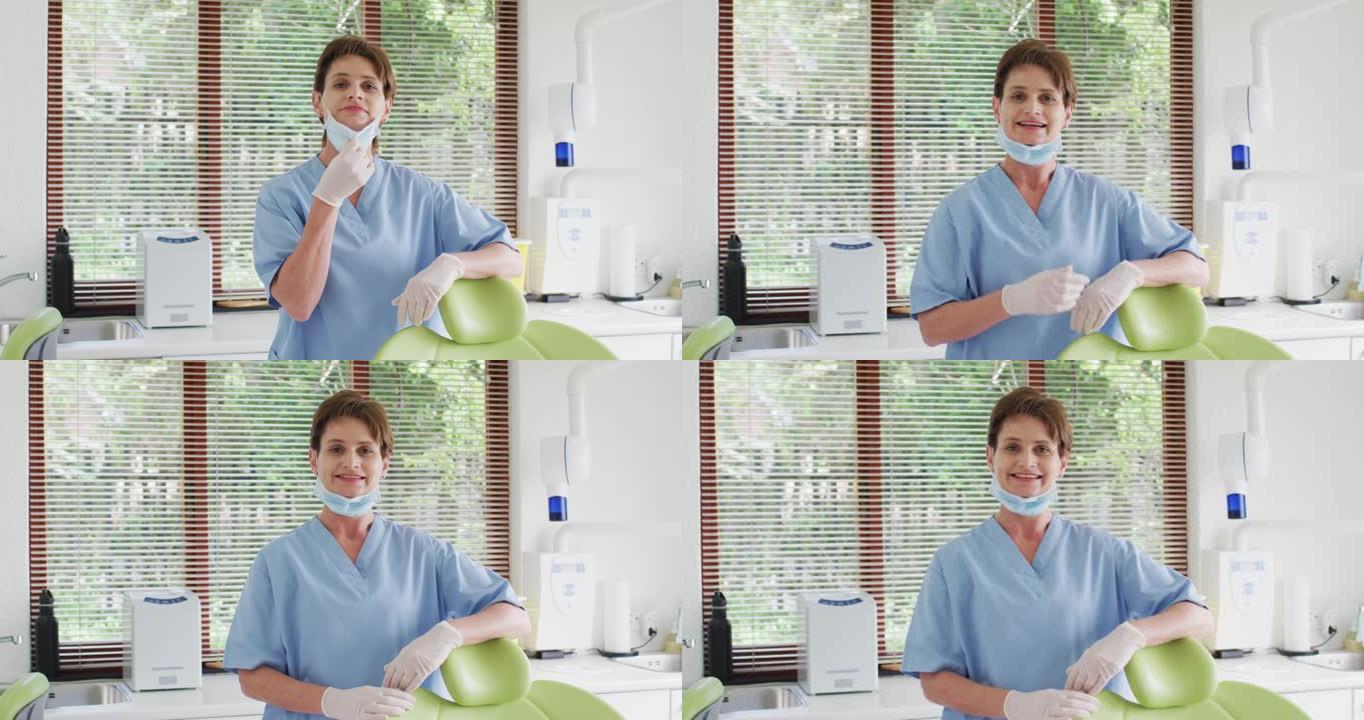 现代牙科诊所微笑的白人女性牙科护士的肖像