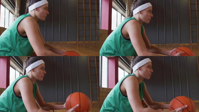 高加索女子篮球运动员休息持球
