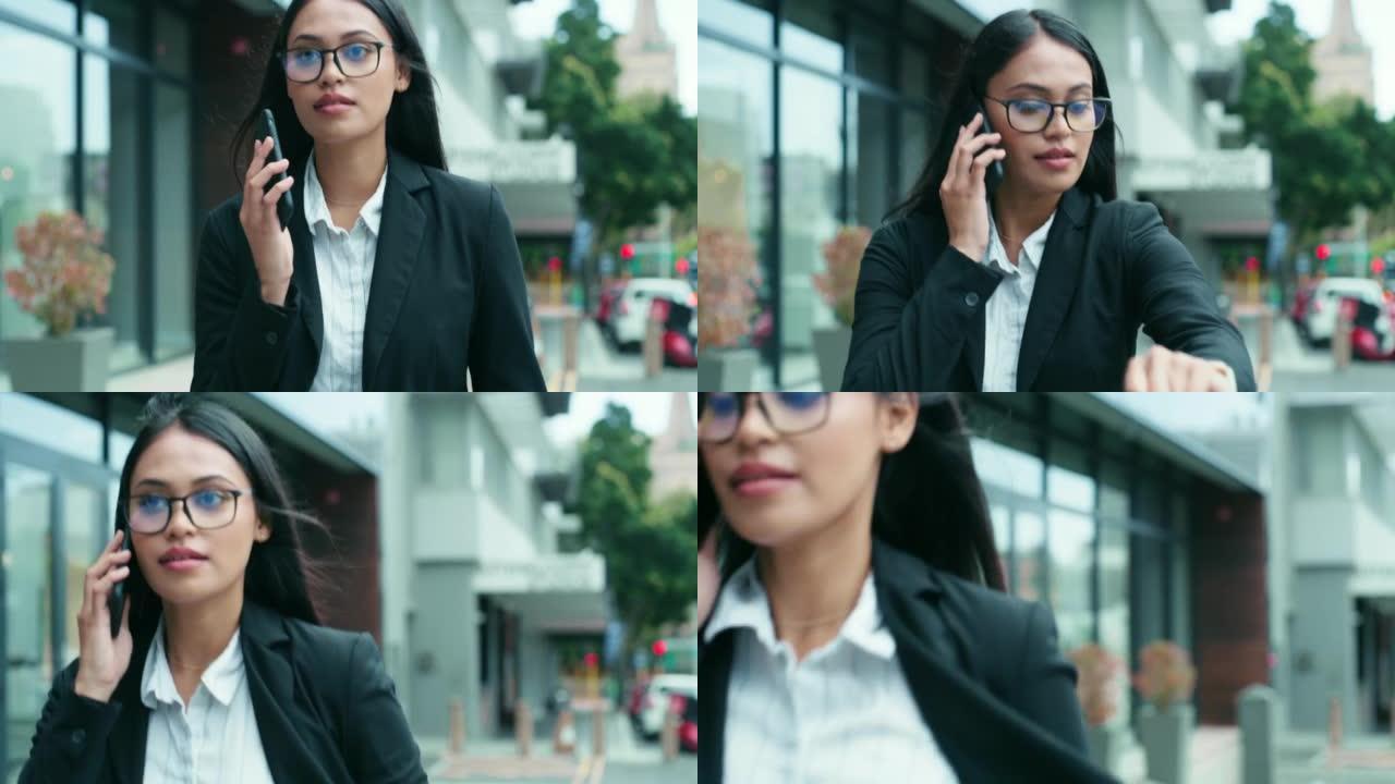 4k视频片段，一名年轻女商人在检查手表时打电话