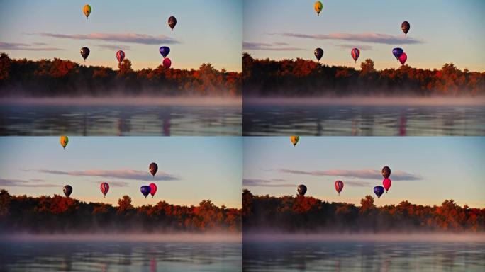 日出时，热气球飞越宁静的雾湖