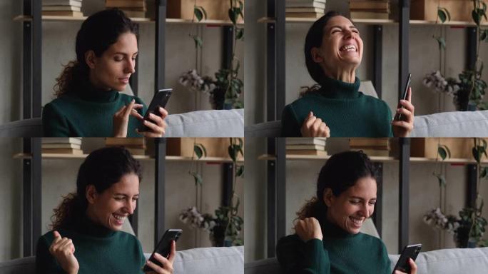 手持智能手机的女人在短信上阅读好消息感到喜出望外
