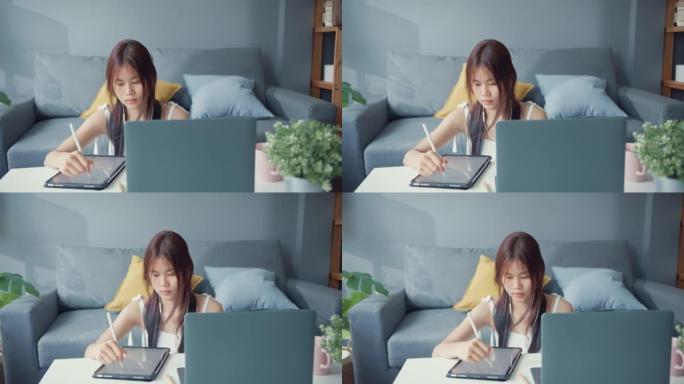 年轻的亚洲女孩青少年穿着休闲衬衫穿耳机使用笔记本电脑在线学习在家里的客厅笔记本电脑上写讲座。隔离教育