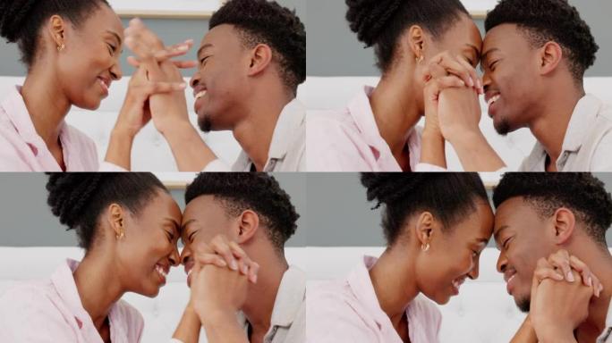 触摸、爱和亲密的黑人夫妇在床上联系在一起，调情和快乐。顽皮的丈夫和妻子表现出爱意，放松并在卧室里享受