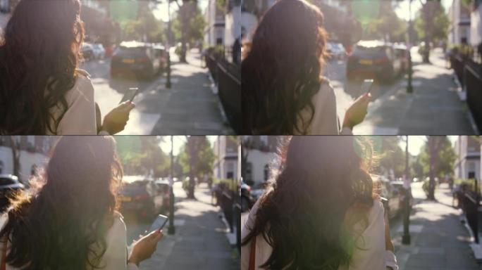 4k后视录像，一名年轻女子在城市外面散步时使用手机