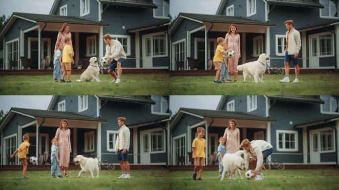 开朗的年轻夫妇带着孩子，和一只美丽的白色金毛猎犬踢足球。快乐的人在房子前面的前院的草坪上与宠物狗打球