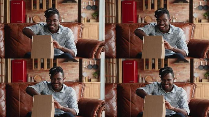 非洲男子用网上购买的优质商品打开包装箱