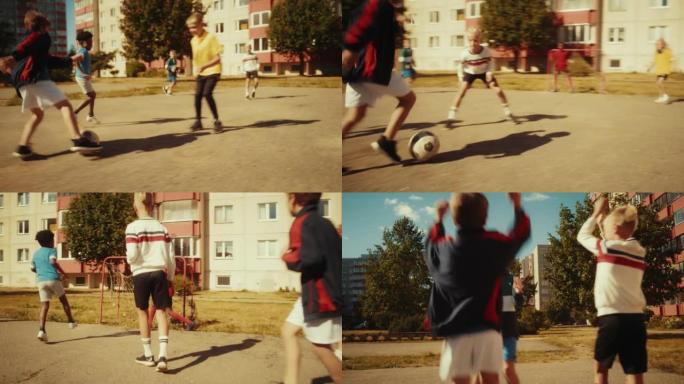 多民族多样的朋友在城市后院外面踢足球。小男孩运球，用球独自传球对手并进球。足球运动员拥抱，庆祝胜利。