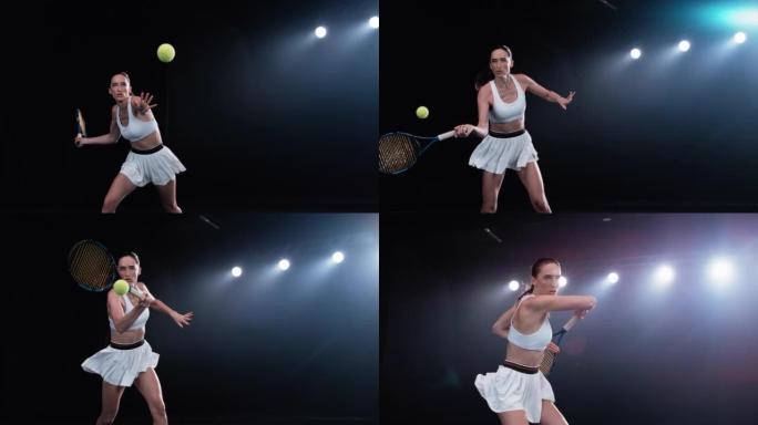 黑色背景下网球飞向运动女运动员的审美跟踪镜头。聚光灯下的职业运动员用球拍击球。电影，弧线，超级慢动作