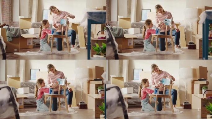 入住和家庭装修: 快乐的母女绘画复古家具椅，为新的舒适的家。开朗的年轻家庭让公寓舒适，配有艺术、色彩