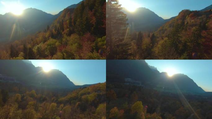 空中: 秋天阴影下的山林，阳光在山顶上窥视