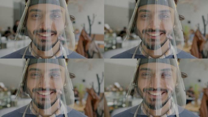 阿拉伯小伙子服务员戴着面罩，在咖啡馆室内微笑的慢动作肖像