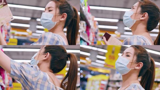 新常态恐慌性购买亚洲女性在超市购物。