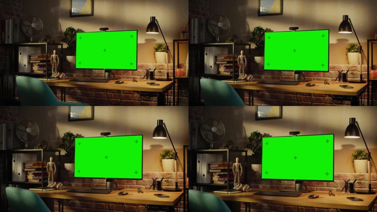 放大现代个人电脑显示器，色度键绿屏显示站在舒适的家庭办公室的桌子上。室内设计师的客厅，品味和创意氛围