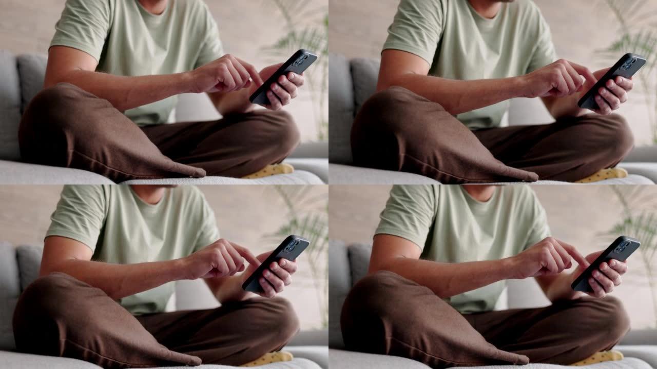 在社交媒体上，男人在家里用手机打字，在沙发上放松，在智能手机应用程序上进行移动聊天，在家里进行技术交
