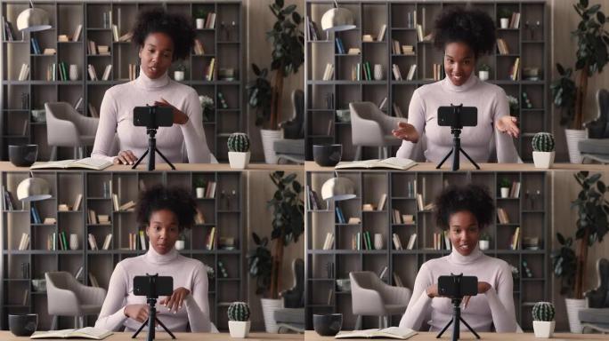 快乐的年轻非洲女性vlogger在智能手机上记录新的vlog
