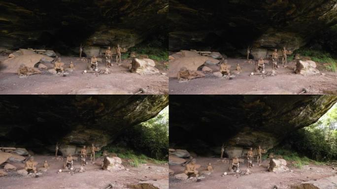 在南非夸祖鲁-纳塔尔省德拉肯斯堡巨人城堡的主要洞穴中，用平镜拍摄的真人大小的丛林人模型场景，描绘了一
