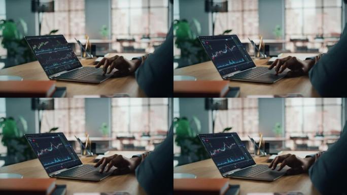 内政部: 匿名金融分析师使用计算机，显示股市图表、数据。从事电子商务投资的远程工作非裔美国商人。相机
