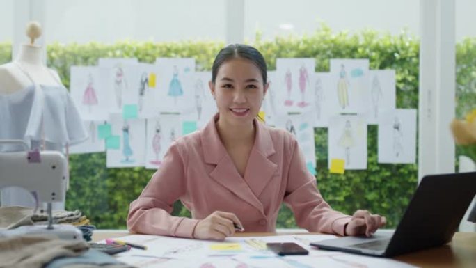 微笑亚洲女性时装设计师小企业主企业家。