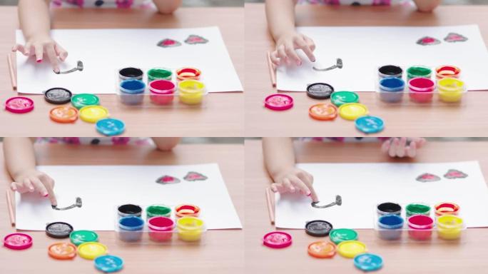 小女孩绘画与彩色水粉画在白纸上，儿童教育创造力发展与艺术