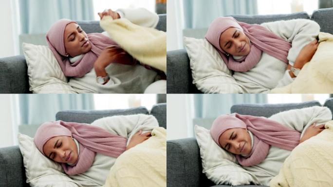 穆斯林，时期抽筋和胃痛的妇女躺在沙发上感到不适，由于子宫内膜异位症在家里。因月经导致腹部、腹部和消化