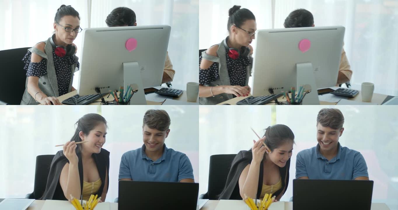 SLO MO同事小组使用计算机并在现代办公室中进行讨论