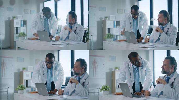 年轻的非洲裔美国医生正在一家医疗诊所与一名高级医生交谈。同事在医院办公室讨论笔记本电脑的工作。助理向
