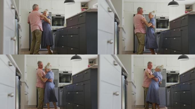快乐的高加索高级夫妇在厨房跳舞的动画