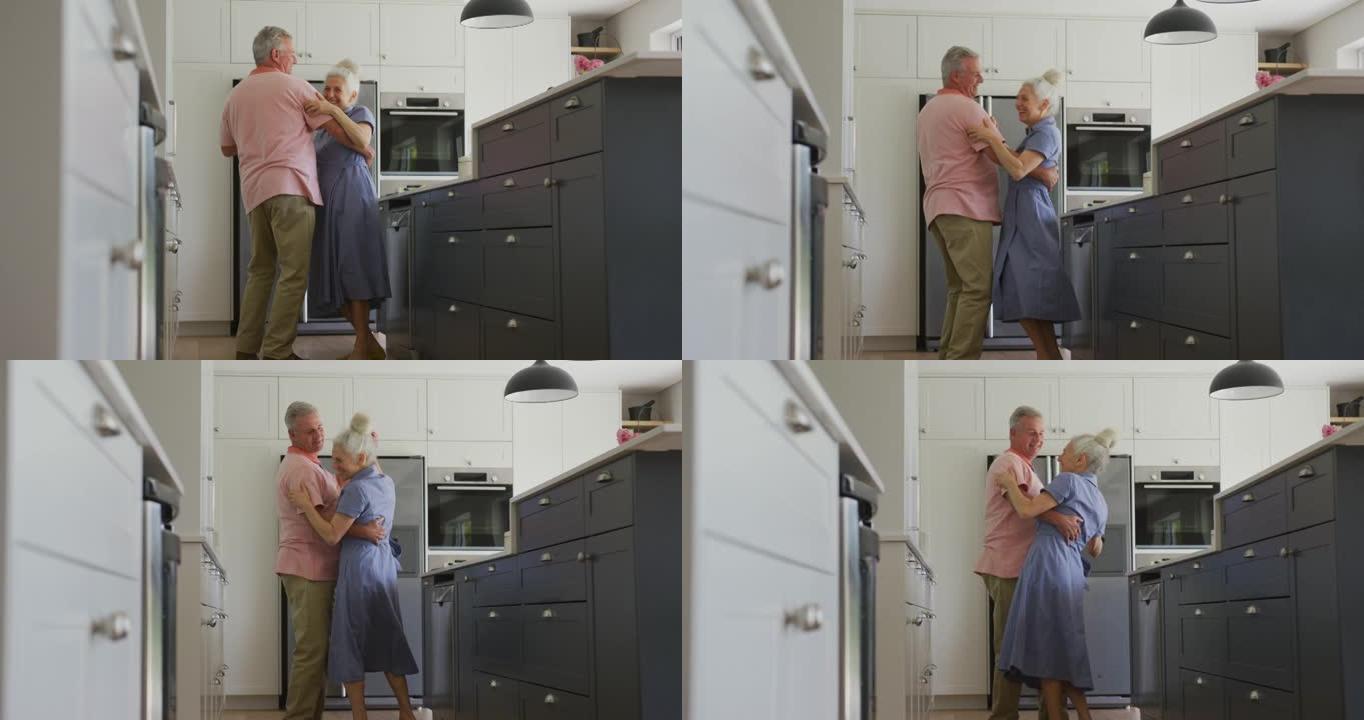 快乐的高加索高级夫妇在厨房跳舞的动画